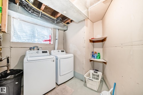 Dedicated laundry area featuring a full-size washer and dryer - 10017 153 Street, Edmonton, AB - Indoor Photo Showing Laundry Room