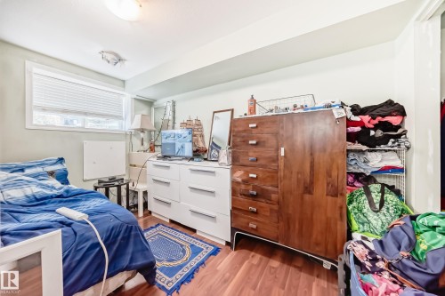Interior room featuring wood-finish flooring and light-toned walls - 10017 153 Street, Edmonton, AB - Indoor Photo Showing Bedroom