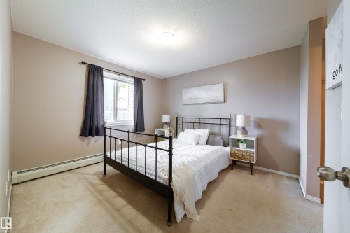 Carpeted bedroom with neutral wall tones and a single window - 115 4309 33 Street, Stony Plain, AB 