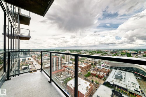 Private balcony featuring glass railings and composite flooring - 2604 10238 103 Street, Edmonton, AB 