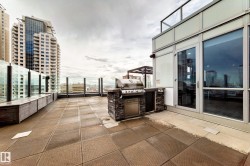 Rooftop patio with patterned tile flooring - 