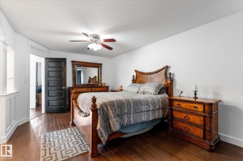 Hardwood-finish flooring enhancing the bright interior - 18 Woodbend Way, Fort Saskatchewan, AB 
