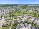 Aerial perspective showcasing a residential area with a green space - 18 Woodbend Way, Fort Saskatchewan, AB 