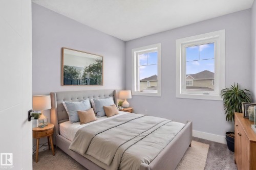 Bedroom featuring light-toned wall paint and carpet flooring - 17733 64A Street, Edmonton, AB 