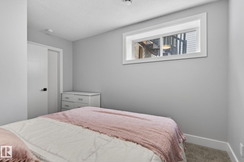 Carpeted room with light grey walls and white trim - 17733 64A Street, Edmonton, AB 