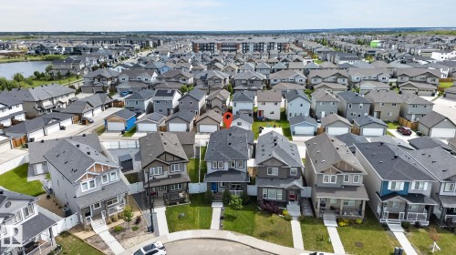 Two-story residence with a light gray exterior and dark gray roof shingles - 17733 64A Street, Edmonton, AB 