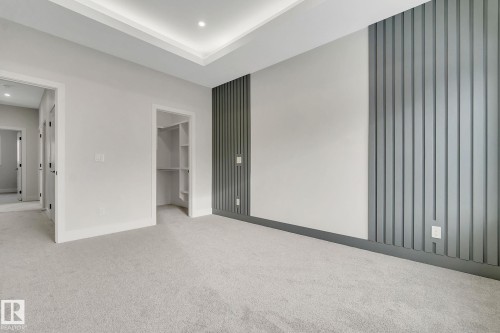 Spacious room featuring light gray carpeting, recessed lighting, and a tray ceiling - 11132 72 Avenue, Edmonton, AB - Indoor Photo Showing Other Room
