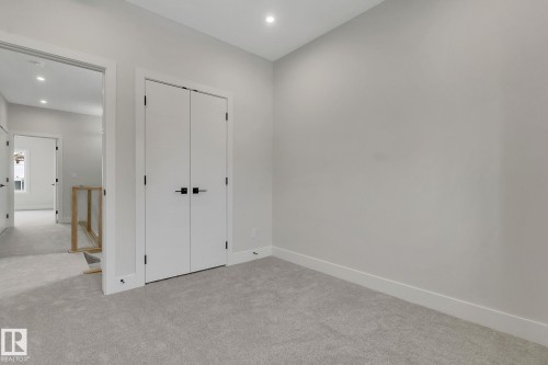 Room featuring light gray carpeting and white trim - 11132 72 Avenue, Edmonton, AB - Indoor Photo Showing Other Room