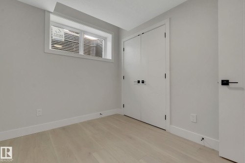 Interior room featuring light wood-finish flooring and a neutral wall color - 11132 72 Avenue, Edmonton, AB - Indoor Photo Showing Other Room