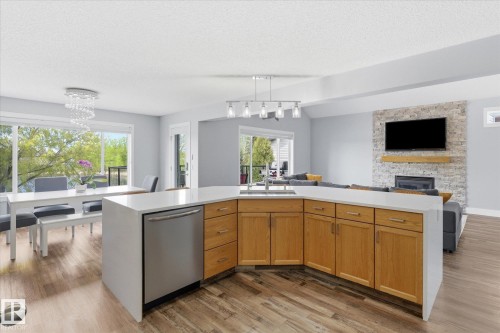 3948 42 Street, Edmonton, AB - Indoor Photo Showing Kitchen With Fireplace