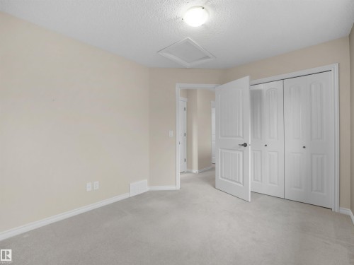 Light-colored carpeting with matching baseboards - 21316 45A Avenue Nw, Edmonton, AB 
