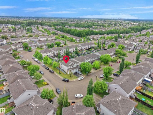 Aerial perspective of a residential neighborhood featuring detached and attached properties with asphalt shingle roofs - 21316 45A Avenue Nw, Edmonton, AB 