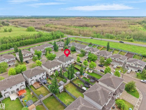 Aerial perspective of a residential community featuring multiple homes with gray shingle roofs - 21316 45A Avenue Nw, Edmonton, AB 