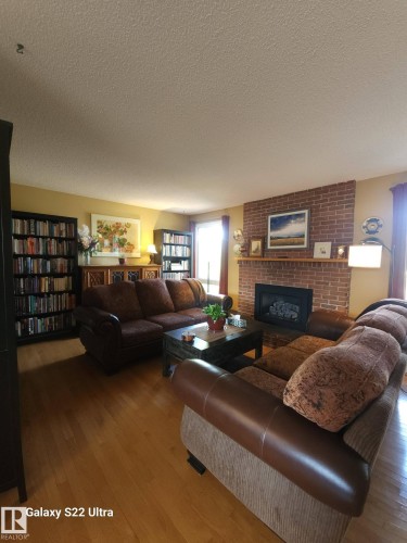 4419 43 Avenue, Leduc, AB - Indoor Photo Showing Living Room With Fireplace