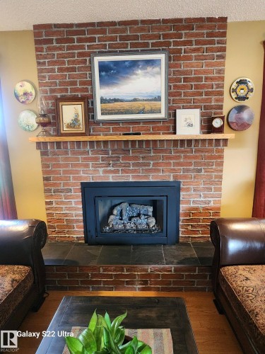 4419 43 Avenue, Leduc, AB - Indoor Photo Showing Living Room With Fireplace