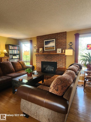 4419 43 Avenue, Leduc, AB - Indoor Photo Showing Living Room With Fireplace