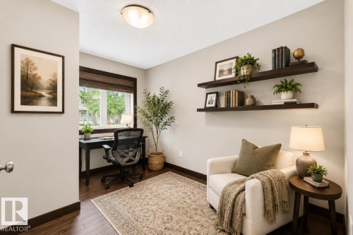 Dedicated room with wood-finish flooring and light-toned walls - 8506 80 Avenue, Edmonton, AB 