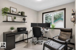 Dedicated room featuring light-toned walls, dark trim, and a window providing natural light - 