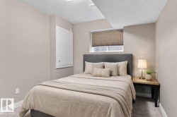 Carpeted bedroom with neutral wall tones and white baseboards - 