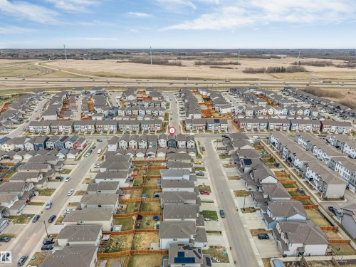 Aerial perspective showcasing a residential community with varied architectural styles - 2652 Maple Way, Edmonton, AB - Outdoor With View