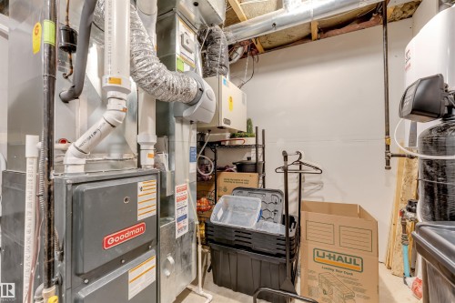 Utility area featuring a Goodman furnace, water heater, and water filtration system - 2652 Maple Way, Edmonton, AB - Indoor Photo Showing Basement