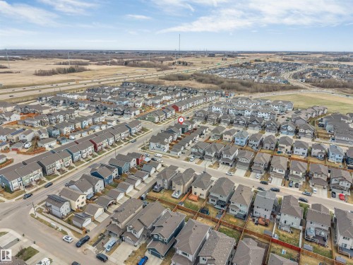 Residential neighborhood featuring various architectural styles, paved streets, and a highway in the distance - 2652 Maple Way, Edmonton, AB - Outdoor With View