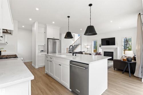 2243 Donaghey Way, Edmonton, AB - Indoor Photo Showing Kitchen With Fireplace With Upgraded Kitchen