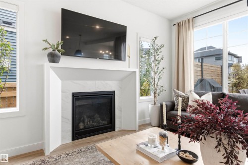 2243 Donaghey Way, Edmonton, AB - Indoor Photo Showing Living Room With Fireplace