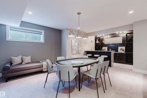 Recreation room featuring a built-in wet bar, recessed lighting, and carpeted flooring - 3435 Keswick Boulevard, Edmonton, AB 