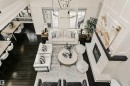 Soaring ceilings with paneling detail enhance this open concept living space - 3435 Keswick Boulevard, Edmonton, AB 