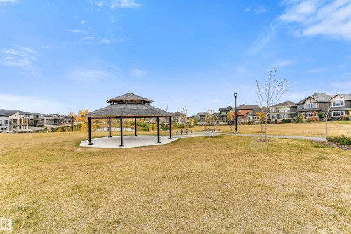 Community park pavilion with a multi-tiered roof and concrete base - 3435 Keswick Boulevard, Edmonton, AB 