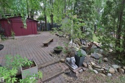 Brick paver patio and walkways with a built-in water feature and pond - 