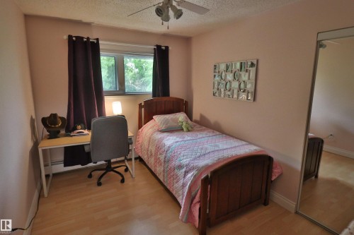 Light wood-finish flooring complements the pastel wall tones - 42 Alpaugh Crst, Leduc, AB 