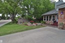 Brick exterior with a prominent address marker - 42 Alpaugh Crst, Leduc, AB 