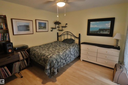 Light wood-finish flooring complements the neutral wall color - 42 Alpaugh Crst, Leduc, AB 