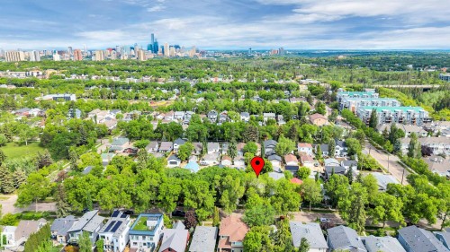 Aerial perspective showcasing a residential area with extensive tree coverage - 9624 77 Avenue, Edmonton, AB 