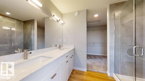 Dual vanity with undermount sinks, quartz countertop, and brushed nickel fixtures - 3918 3A Avenue, Edmonton, AB 