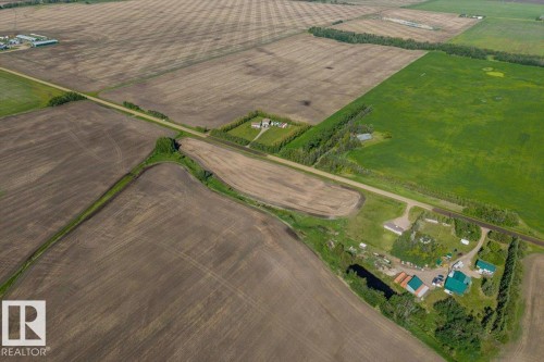 Expansive agricultural landscape featuring cultivated fields and a rural road system - 0 0, Rural Sturgeon County, AB 