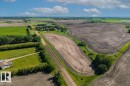 Expansive agricultural landscape featuring cultivated fields and green spaces - 0 0, Rural Sturgeon County, AB 