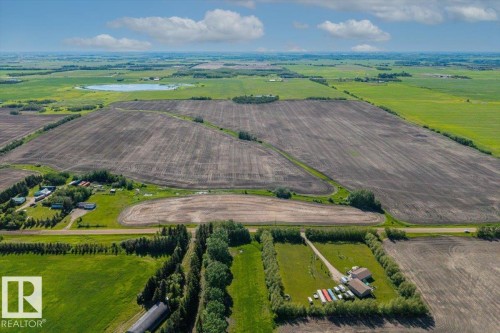 Expansive aerial property featuring agricultural fields and a distinct land parcel - 0 0, Rural Sturgeon County, AB 