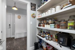 Kitchen pantry featuring extensive open shelving - 