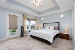 Recessed tray ceiling with patterned insert and decorative ceiling light - 
