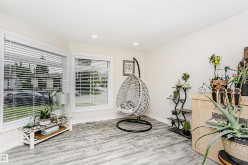 Bright interior space featuring light wood-finish flooring - 5610 57 Avenue, Beaumont, AB 