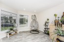 Bright interior space featuring light wood-finish flooring - 5610 57 Avenue, Beaumont, AB 