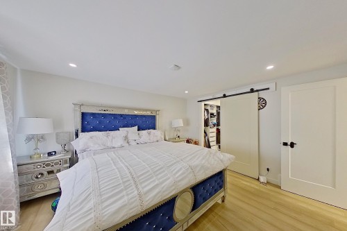 Recessed ceiling lighting illuminates light wood-finish flooring - 3054 28 Avenue, Edmonton, AB 