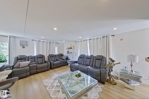 Spacious interior with wood-finish flooring and recessed lighting - 3054 28 Avenue, Edmonton, AB 