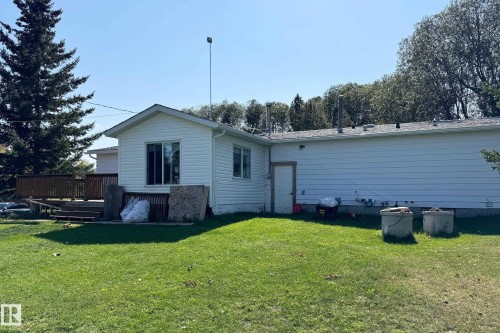 White siding exterior with a dark shingle roof - 3054 28 Avenue, Edmonton, AB 