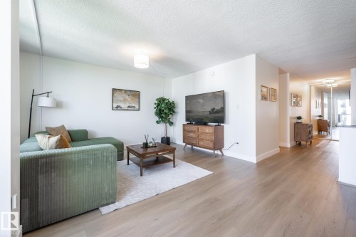 Living room, open to the kitchen and dining areas - 807 10011 116 Street, Edmonton, AB 