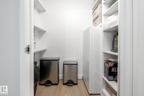 Dedicated utility closet featuring light wood-finish flooring - 807 10011 116 Street, Edmonton, AB 