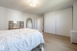 Light-toned wood-finish flooring complements the neutral wall palette - 